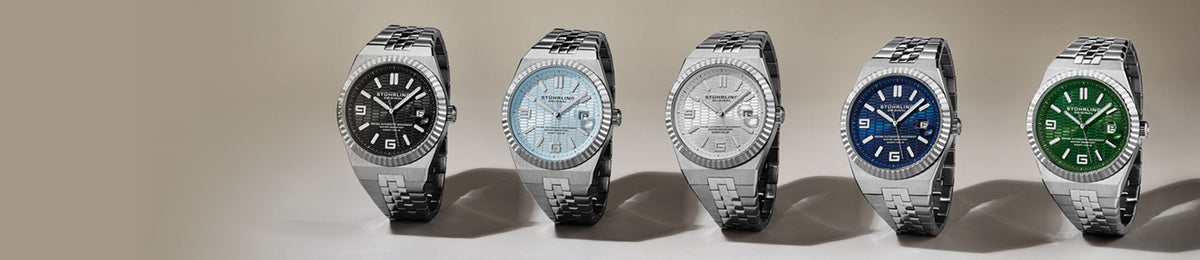Five watches with different colored faces displayed on a beige background