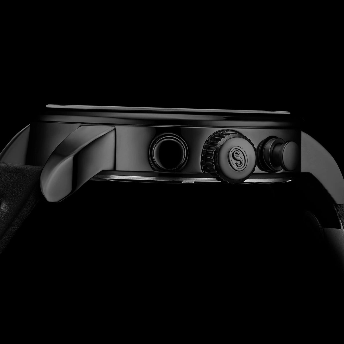 Close-up of a watch with a black background